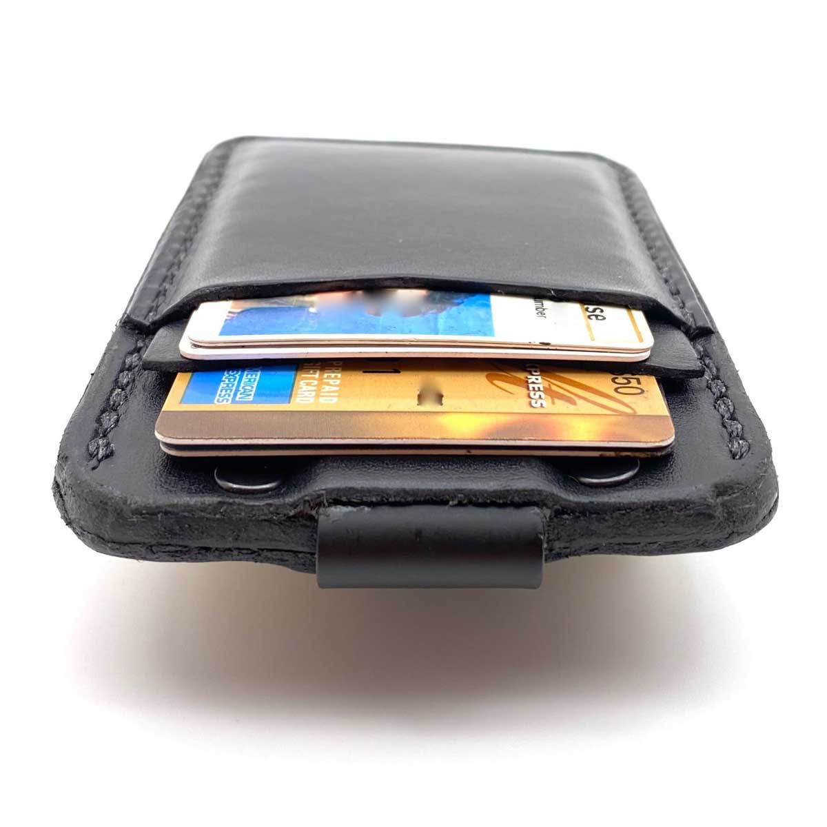 Top side of Black Bridle leather minimalist wallet with credit cards in pockets