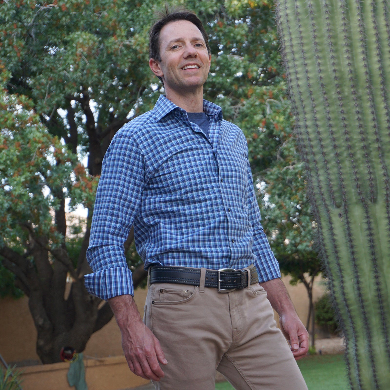 Male model in blue shirt wearing Wide Shelby leather belt