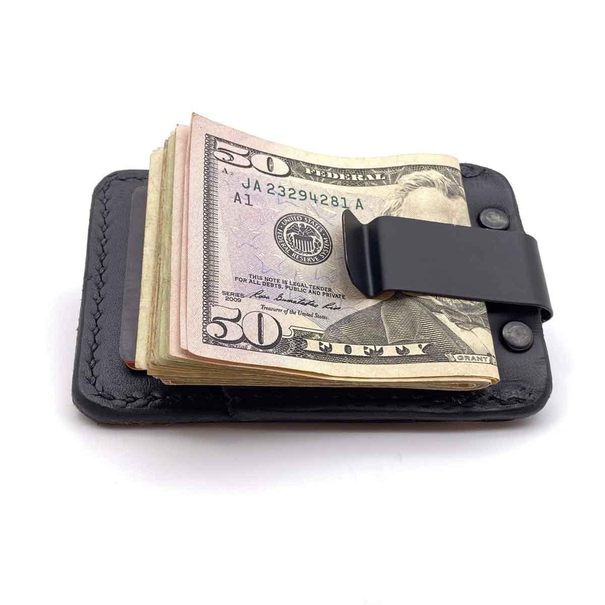 Back side of Black Bridle leather minimalist wallet with money in clip